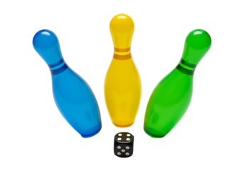 Three colorful bowling pins and a die isolated on transparent background
