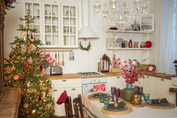 Classical Christmas decorated interior kitchen. Modern classic style interior design apartment dining room and Christmas tree with red golden ornament decorations. Christmas eve at home