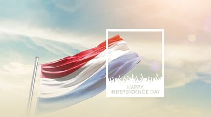 Netherlands flag waving proudly under a bright sky with text happy independence day. Netherlands...