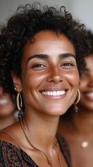 A woman with a smile on her face and a necklace around her neck. She is wearing a brown dress