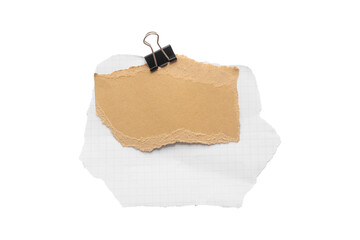 Torn piece of school notebook in a grid and brown piece of paper with beige tape and black binder isolated on white background