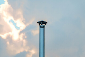 metal chimney on background of sky