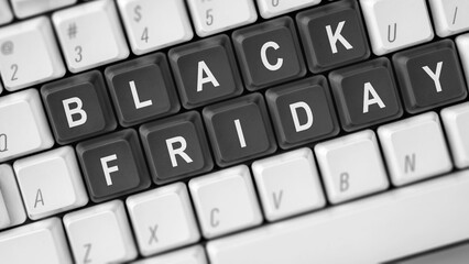 Closeup view of Black Friday text on the computer keyboard button. Copy space. Black Friday sale concept