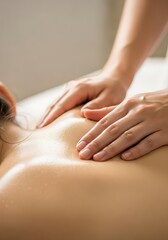 Relaxing massage on oiled skin hands back