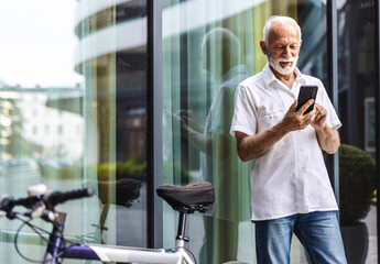 City, bicycle and business man with phone walking for morning commute, travel and journey to work. Sustainable transport, eco friendly bike and person on smartphone for networking, text and contact.