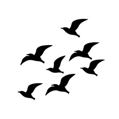 A flock of birds flying in formation against a white background
