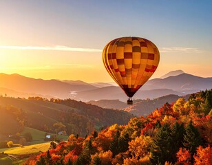 Naklejka premium Hot air balloon over autumnal mountains at sunrise
