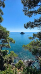 Seaside view of azure ocean with a small island framed by lush green foliage on a sunny day