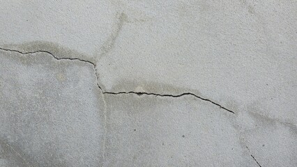 Old grey concrete wall, cracked, broken, stained, building wall, house wall, damaged house...