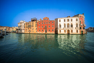 Sunlit cannaregio canal with palazzo labia in venice