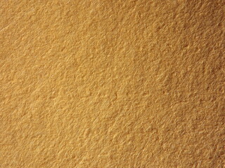 The textured surface is brown, red in color as a background. Felt. High quality photo