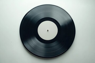 Fototapeta premium A close-up, top-down shot of a vinyl record, showing grooves, central label, and simple background