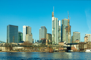skyline of Frankfurt am Main seen from iron footbridge crossing river Main