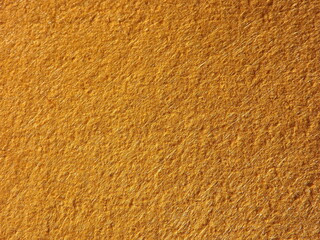 The textured surface is brown, red in color as a background. Felt. High quality photo