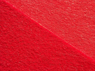 The textured surface is red pink raspberry, light green, pistachio color, herbal color as a background. Felt. High quality photo