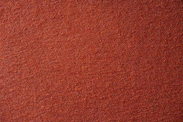Close-Up of Soft Rust-Colored Knitted Fabric Surface