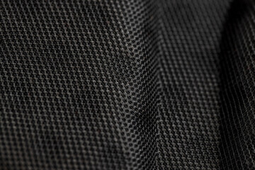 synthetic fabric for the production and tailoring of clothes and bags, black fabric made of black threads resistant to damage