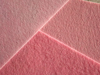 The textured surface is brown, red in color as a background. Felt. High quality photo