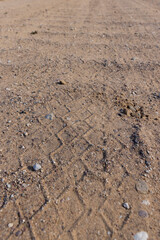 a road in rural areas with a lot of bumps, a very dangerous and uneven road for motor vehicles in the village