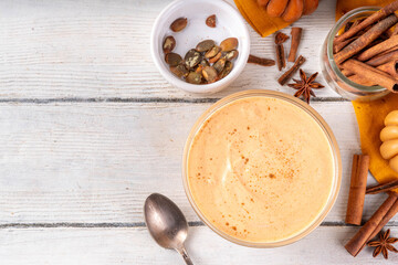 Pumpkin Spice Greek Yogurt in glass bowl, with spices, cinnamon, healthy autumn snack with traditional fall season taste, protein and calcium source