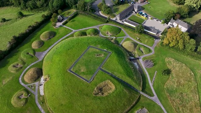 Beautiful drone view of Neolithic monument Knowth in Ireland. Green mounds and tombs.