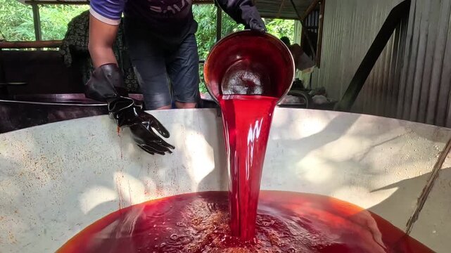 Pouring Dye into Large Batch Tank in Textile Dyeing Process