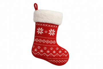 Red knitted christmas stocking with white faux fur cuff and snowflake patterns, holiday season tradition