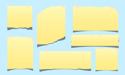 set of blank yellow sticky notes with paper tape isolated on blue background