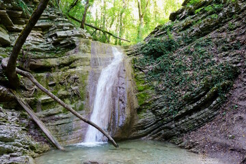 Tenginsky waterfall in the gorge close-up. Beauty in nature.
