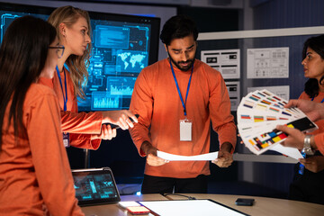 Startup team working together on color palette selection and digital prototypes. Designers and colleagues brainstorm ideas, creativity, technology, and teamwork to achieve innovation in product design