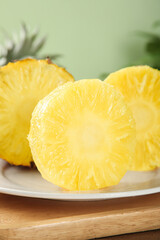 Fresh Hainan Pineapple Slices with Juicy Tropical Fruit Pulp on White Plate