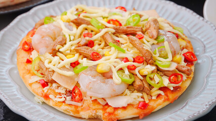 Delicious Homemade Pizza with Shrimp Ham Bacon and Vegetables - Fresh Baked Selection