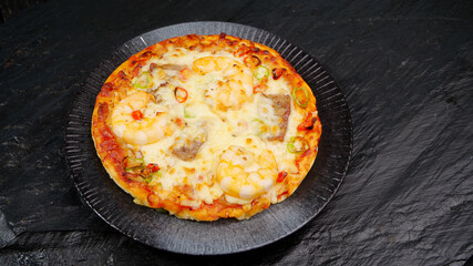 Homemade Pizza with Ham and Cheese on Dark Slate Plate - Delicious Italian Food