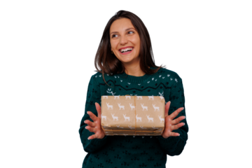 Happy young woman receiving christmas present, smiling in festive sweater, celebrating winter holiday