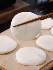 Asian Rice Cakes with Chopsticks - Traditional Glutinous Rice Dessert Preparation