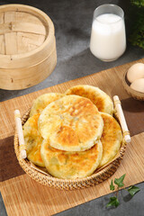Crispy Golden Pancakes in Wicker Basket with Fresh Milk and Eggs Traditional Breakfast Setup