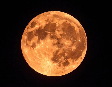 Full, orange-toned moon against dark sky