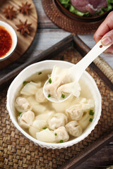 Homemade Wonton Soup with Clear Broth in White Bowl Traditional Asian Cuisine Comfort Food