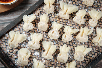 Handmade Fresh Pasta Dumplings on Bamboo Mat Ready for Cooking