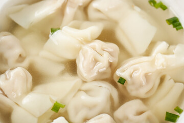 Handmade Wontons in Clear Broth - Freshly Cooked Chinese Dumplings with Green Onions