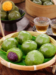 Traditional Green Dim Sum Dumplings in Bamboo Steamer with Tea - Authentic Chinese Cuisine