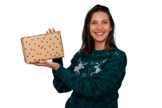 Woman smiling, holding christmas gift box, wearing holiday sweater, offering present on transparent background - Powered by Adobe