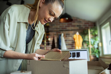 Woman unboxing a package