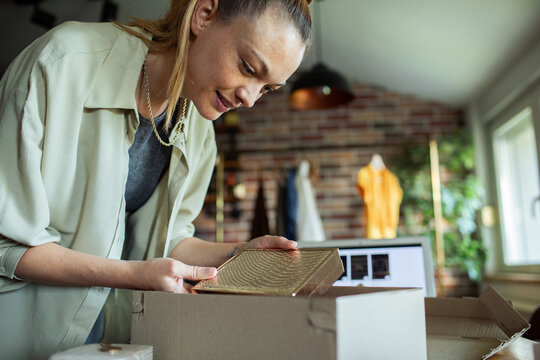 Woman unboxing a package