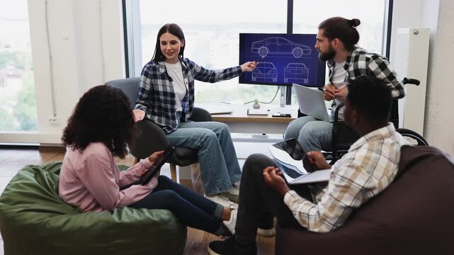 Diverse group of young engineers collaborating on car design project using digital tools. Office features large windows, comfortable seating. Participants are varied in gender, race, ages