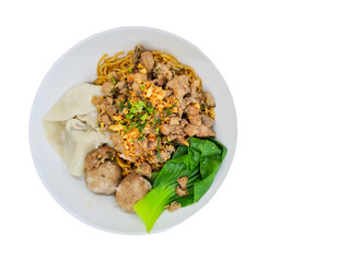 Top view of Indonesian chicken noodle dish Mie Ayam Bakso Pangsit served in a white bowl, isolated on white.