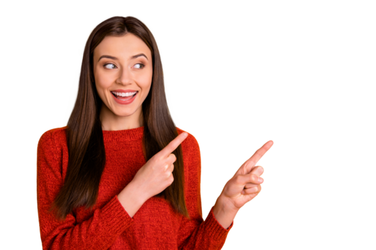 Photo of white cheerful cute nice charming gorgeous millennial pointing at empty space expressing pleasure with face isolated over vivid color background