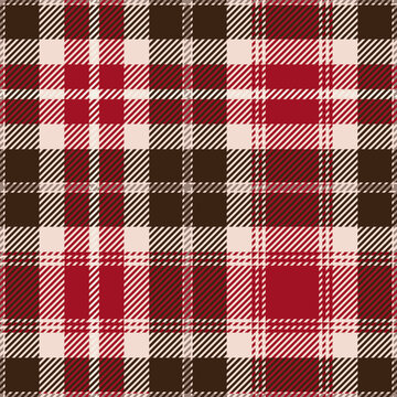 Red and brown tartan plaid. Scottish pattern fabric swatch close-up. 