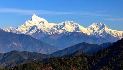 Majestic snow-capped mountain range under a vibrant blue sky