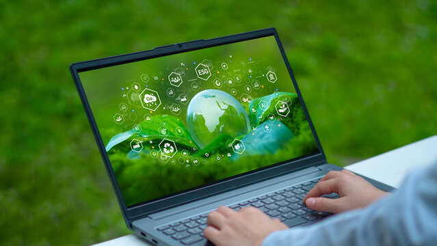 Businessman pressing button on digital technology tablet screen for environment with ESG for environment, social and governance in sustainable and ethical business operations.